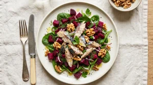 Flaked mackerel, beetroot and walnuts over spinach