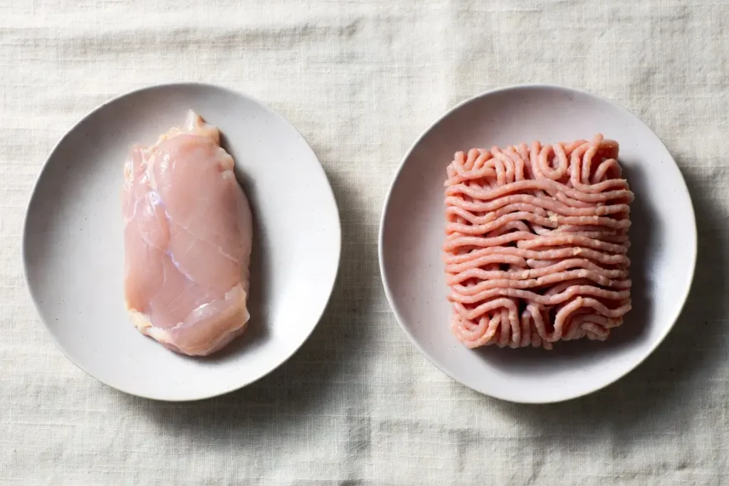 Turkey breast and ground turkey side by side, photographed for nutritional comparison